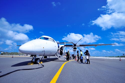 Free White Jet on Black Tarmac Stock Photo