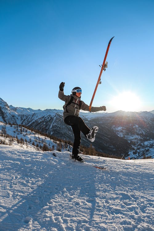 Free Person Skiing Under Blue Sky Stock Photo