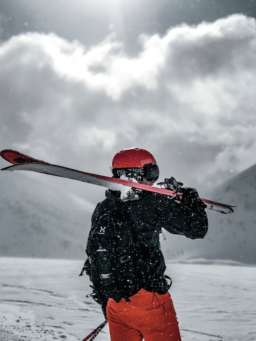 Free Man Carrying Snow Ski Blades Stock Photo