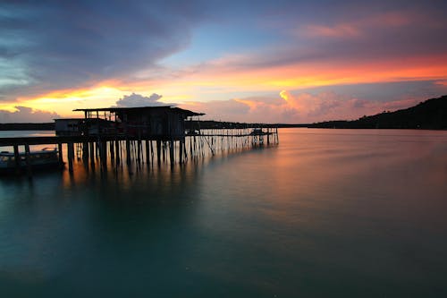 Silhouette Photo of Dock during Sunset