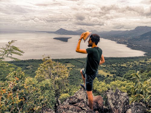 Man  Standing on Rock