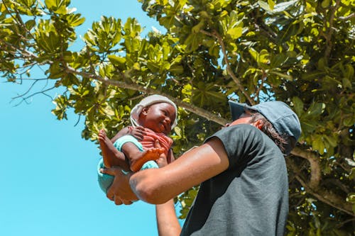 Person Carrying Toddler 