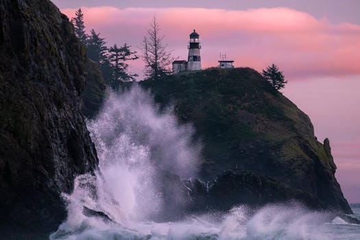 Dramatic cliffside lighthouse overlooking ocean waves against a vivid sunset sky.