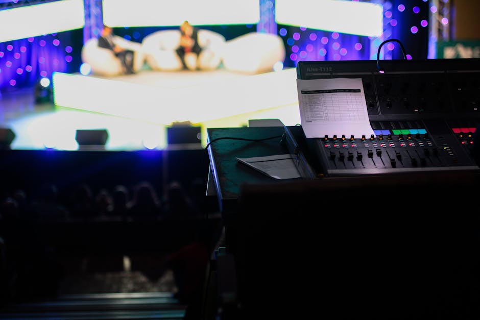 Tech conference stage with large screen showing Google logo