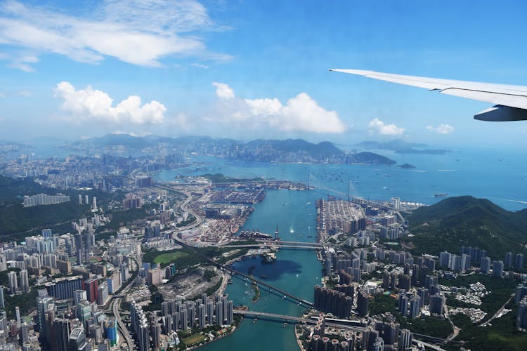 Aerial View Of City Through Airplane Window