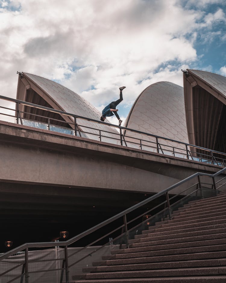 Man Doing Stunt On Rail