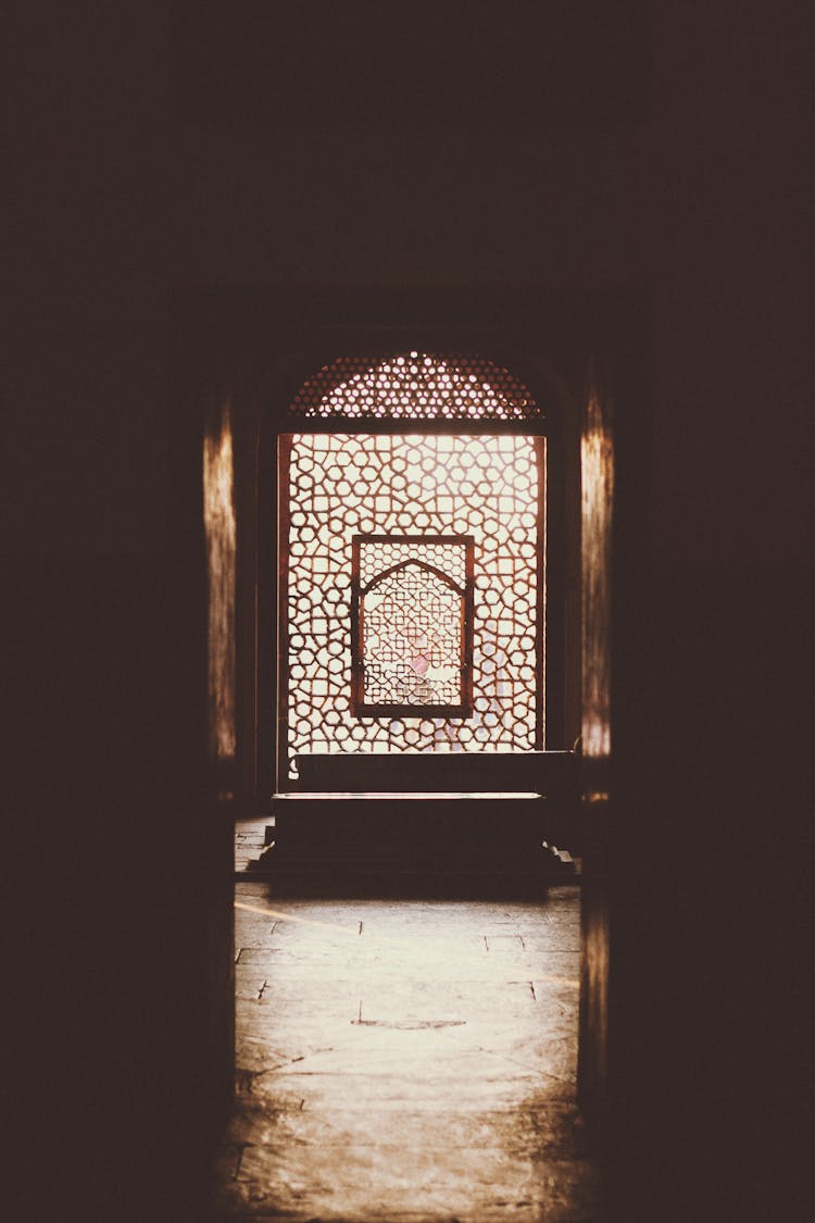 Entrance To A Room With Wooden Divider And Glass