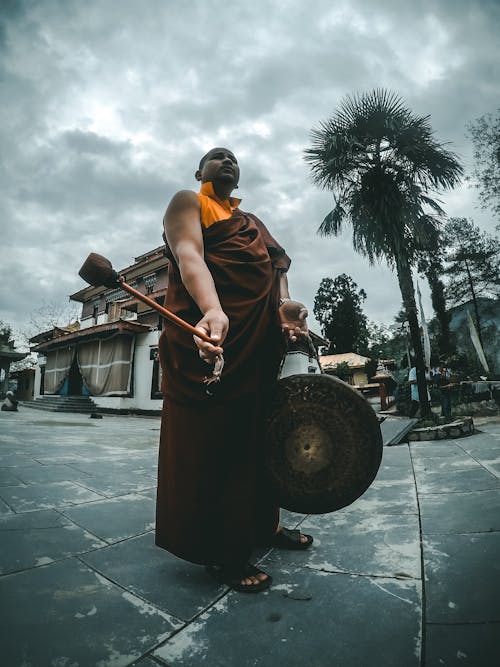 Monk Holding Bell