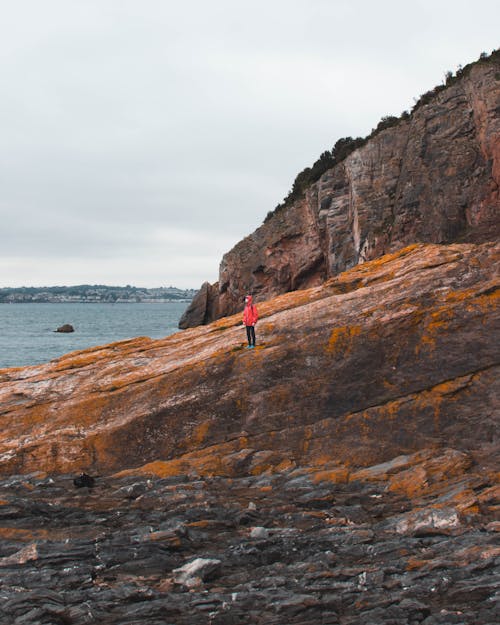 Person Standing Near Sea