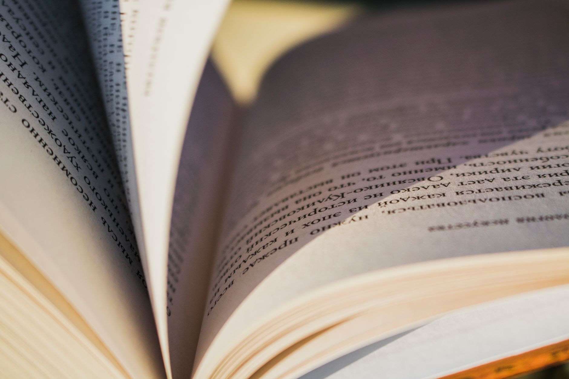 Open book showing textured pages and printed text