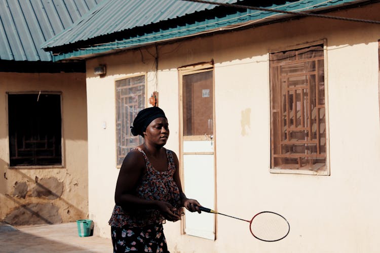 Woman Holding Badminton Racket