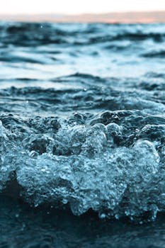 Close-up of ocean waves breaking near Sweden's coast, capturing dynamic water motion.
