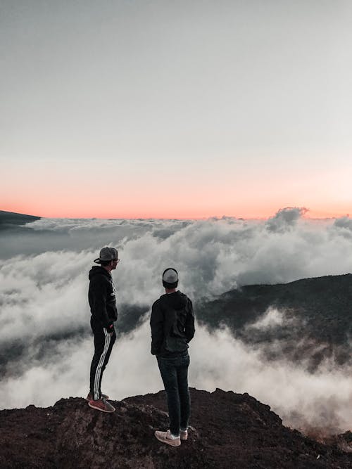 Unknown Persons Standing Outdoors