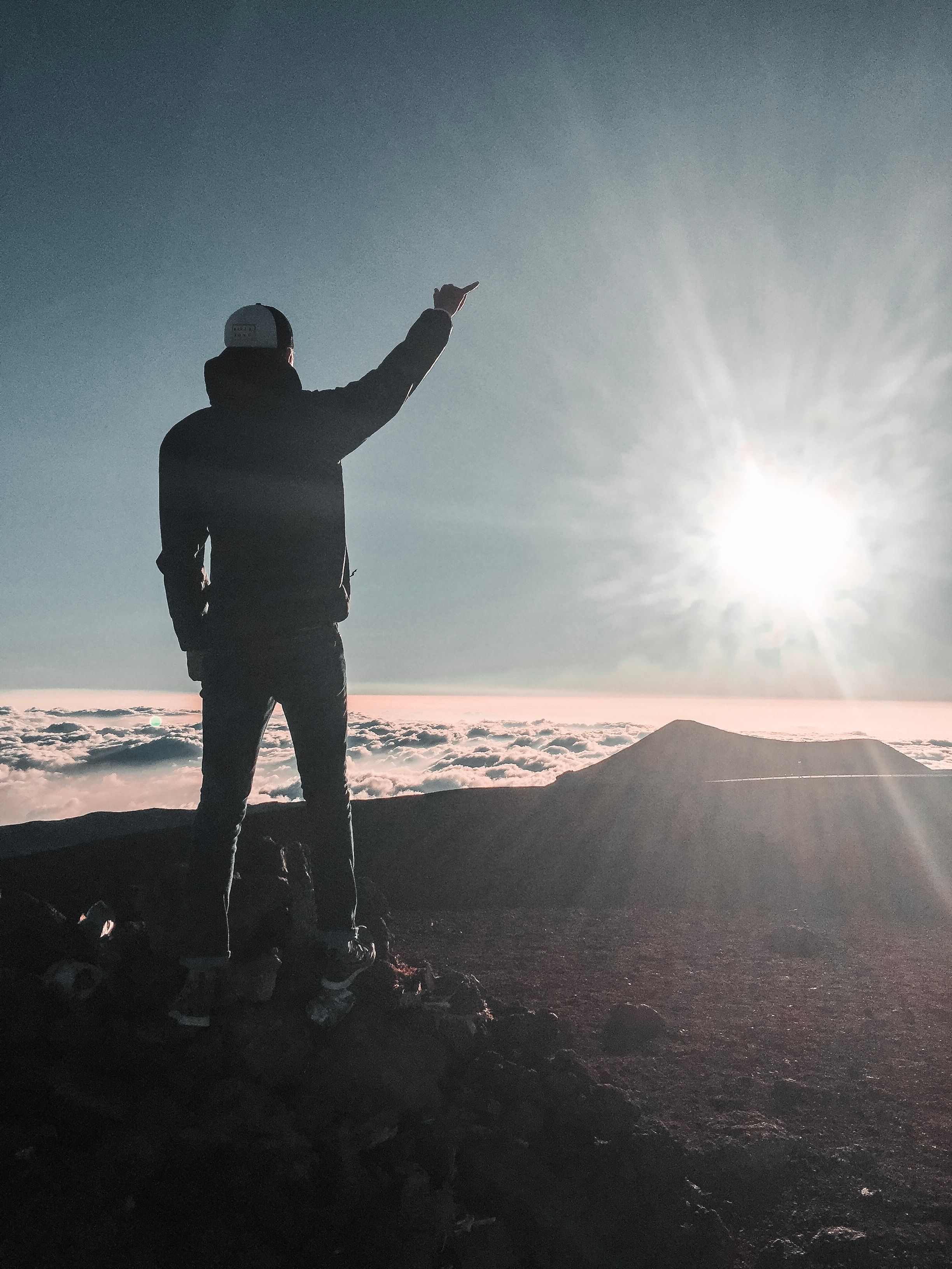 Man Standing Near Sea of Clouds · Free Stock Photo