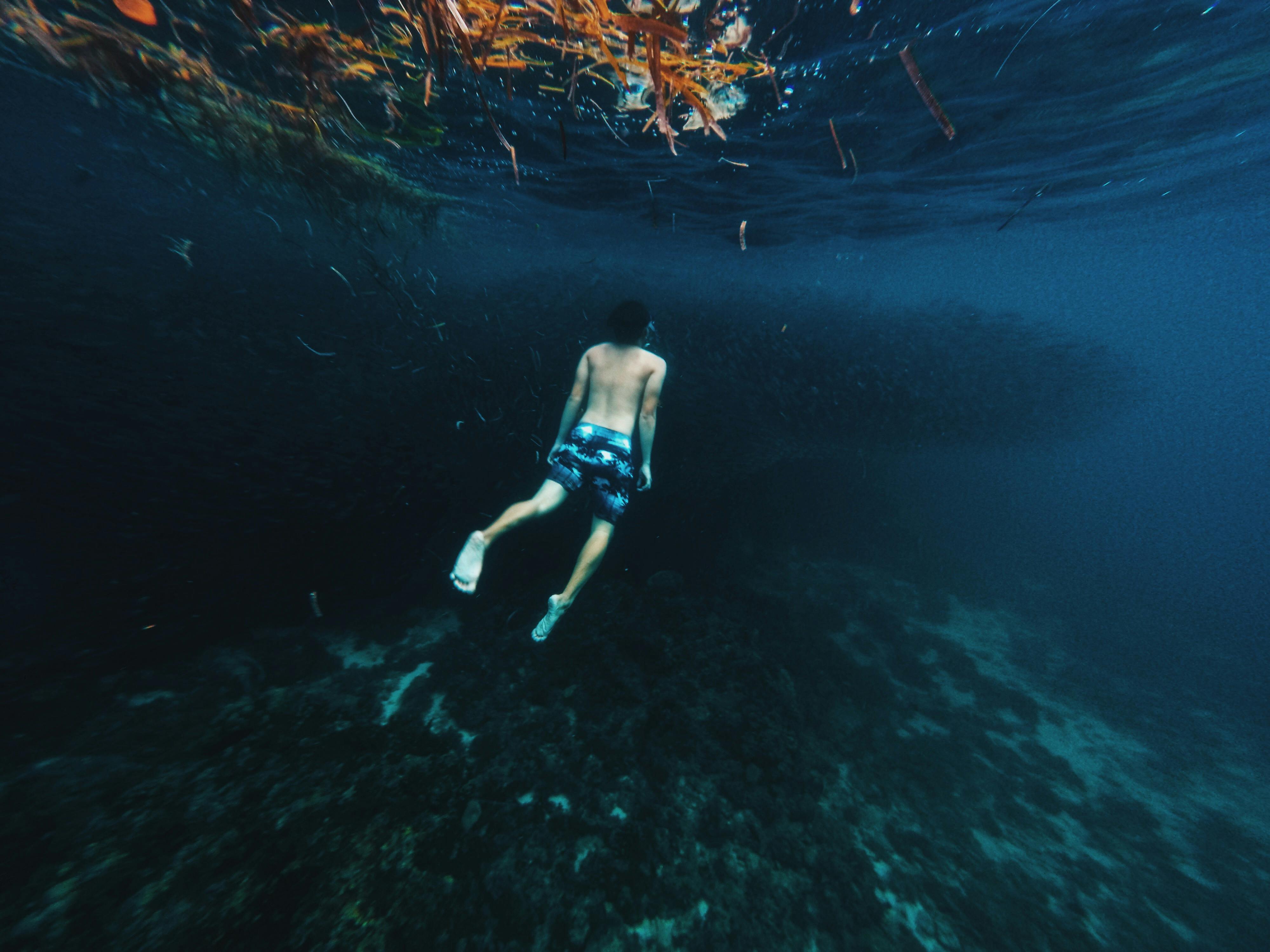 Man Swimming Under Water · Free Stock Photo