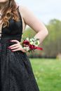 Woman Wearing Black Dress And Flower Bracelet