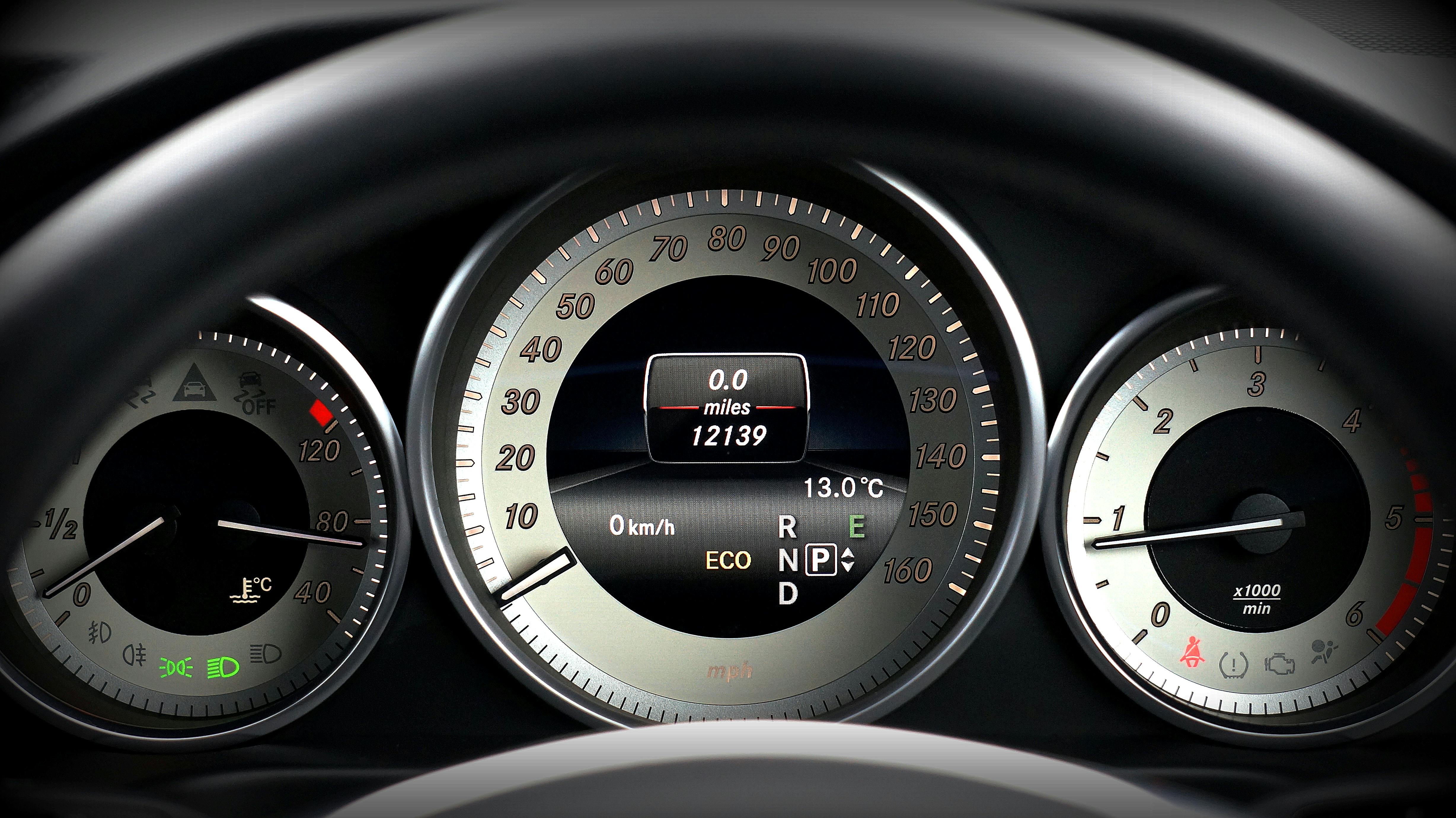 Black and Gray Vehicle Analog Instrument Cluster Panel