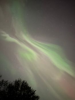 Captivating view of the aurora borealis illuminating the night sky with vibrant colors.
