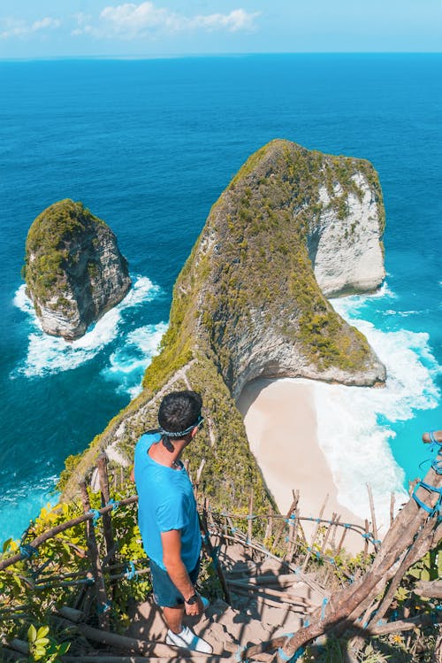 Free Man Standing on Cliff Stock Photo