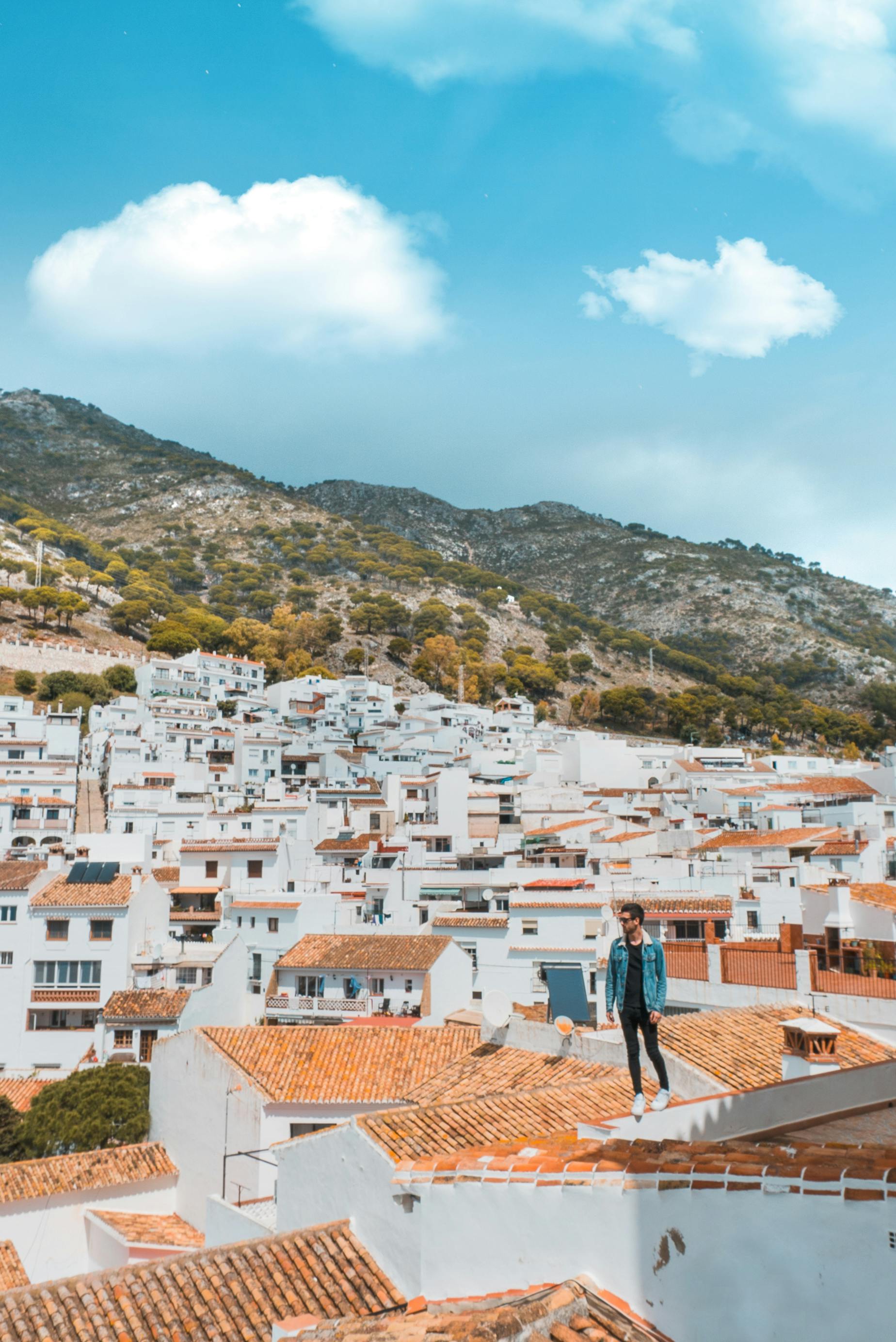 Man Standing on Brown House Roofing · Free Stock Photo