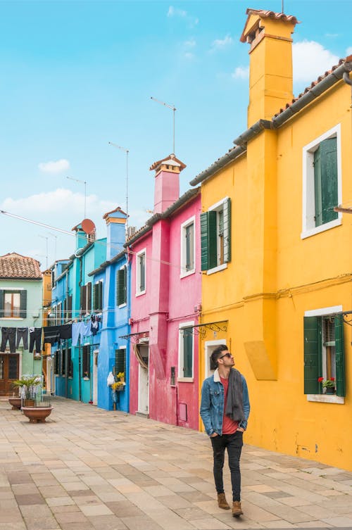 Man Standing Near the House