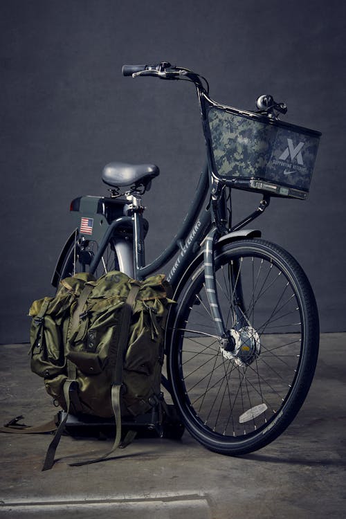 Black Commuter Bike Beside Green Backpack