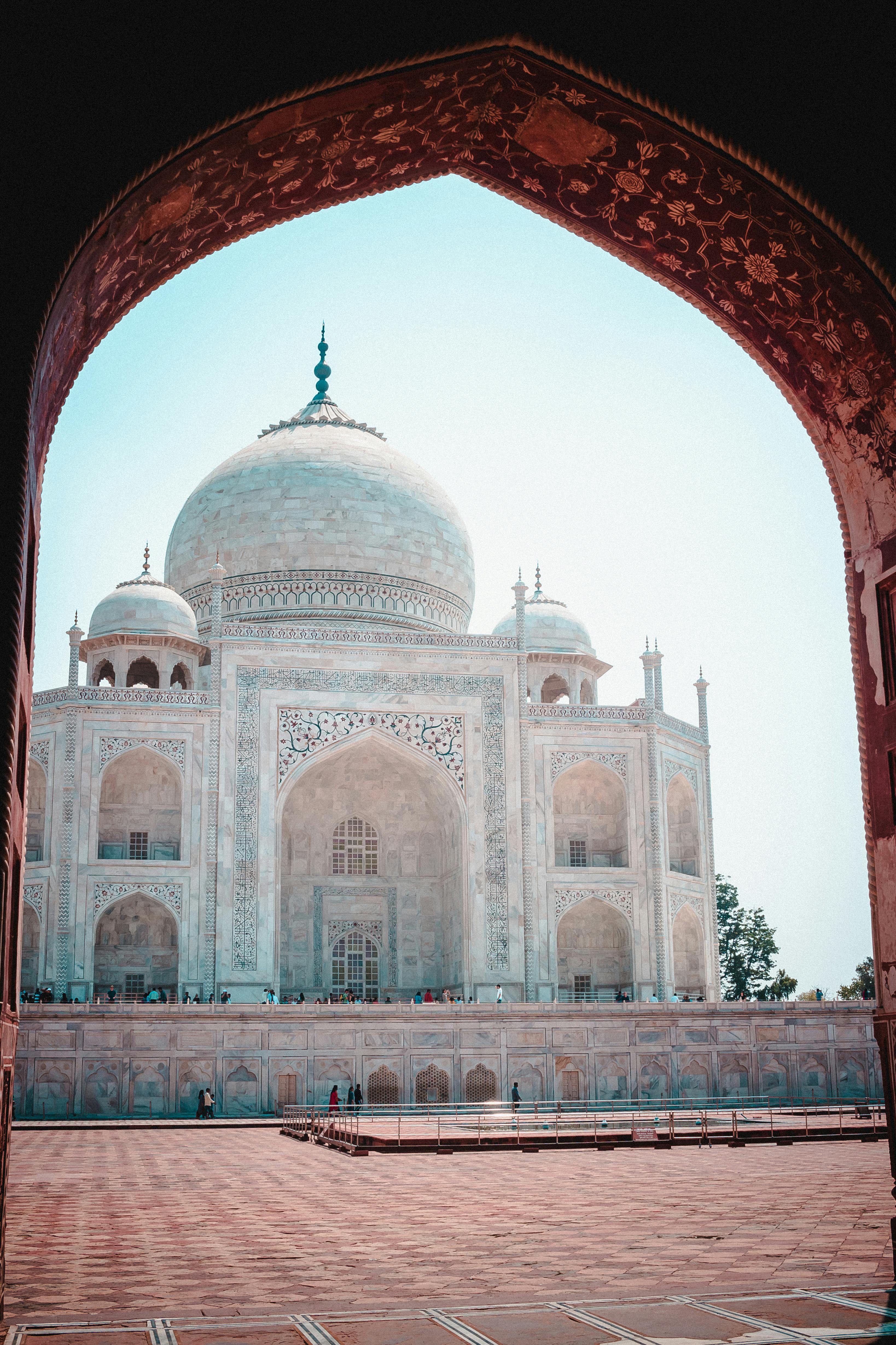 taj mahal through an arch