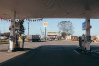 Empty gas station with oil petrol dispensers located on highway for serving long distance vehicles