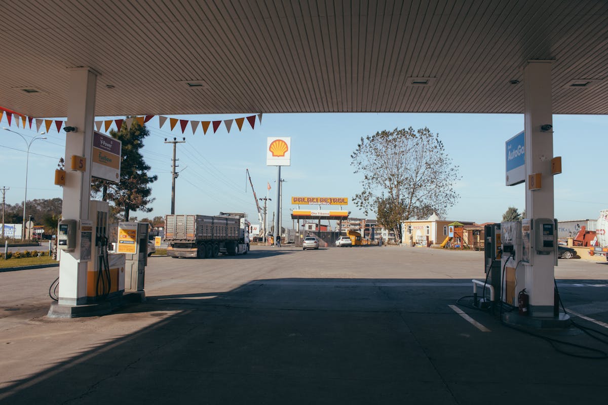Empty gas station with oil petrol dispensers located on highway for serving long distance vehicles