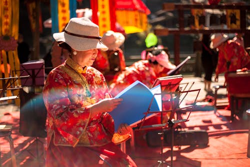 Free Woman Holding Blue Book Stock Photo