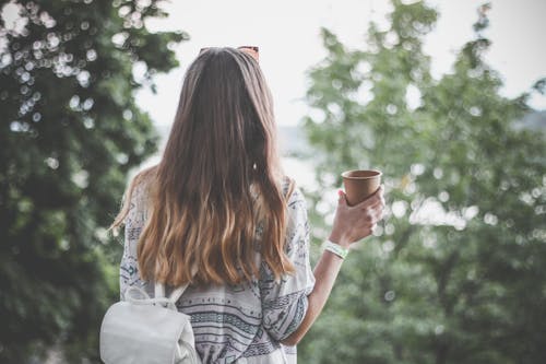 Free Woman Holding Brown Paper Cup Stock Photo