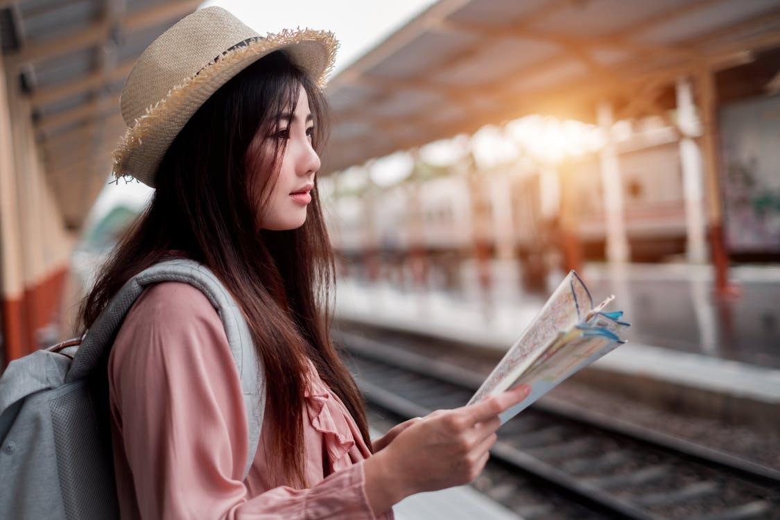 Free Woman Holding Map Stock Photo