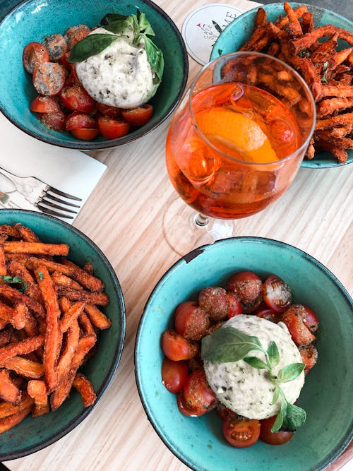 Bowls of Cooked Food on Table