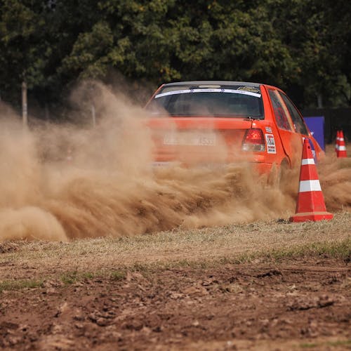 Free Orange Car Racing With Traffic Cones As Barriers Stock Photo