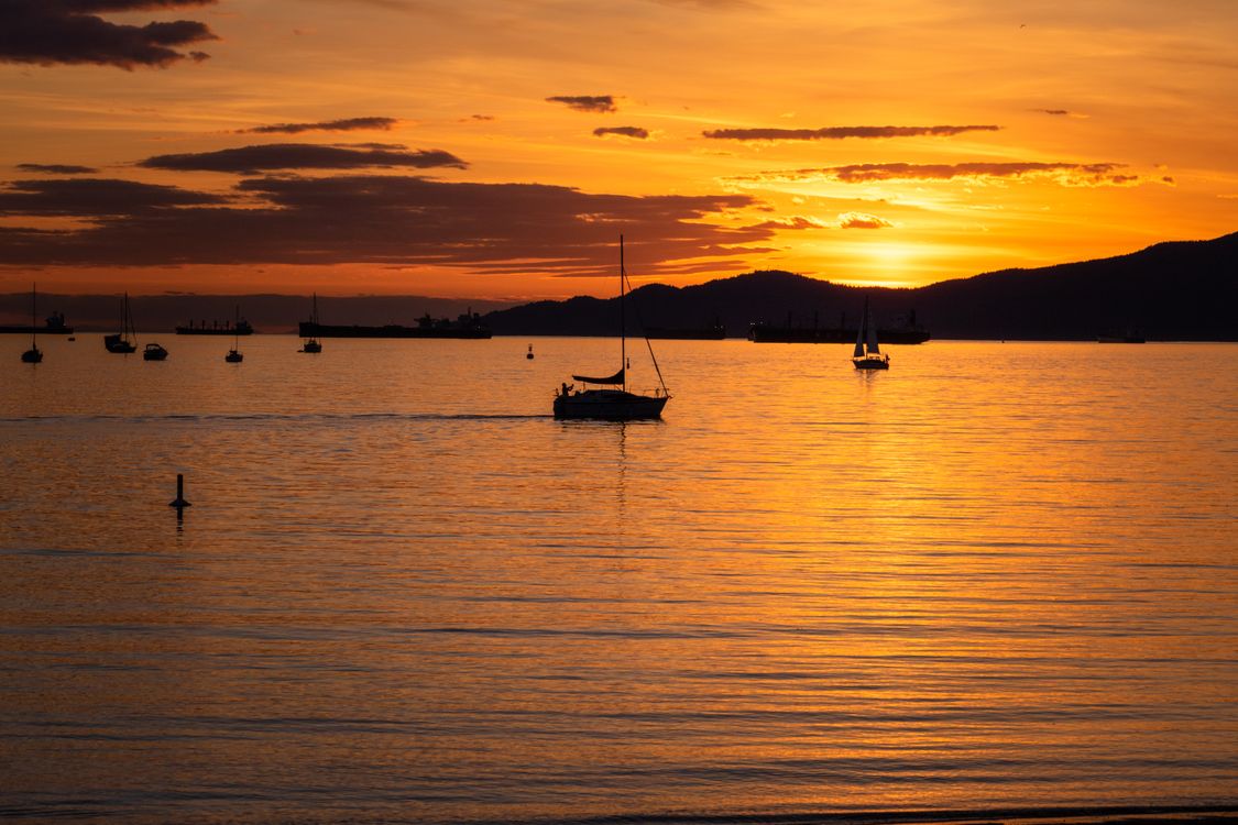 Silhouette Photo of Boat on Body of Water · Free Stock Photo