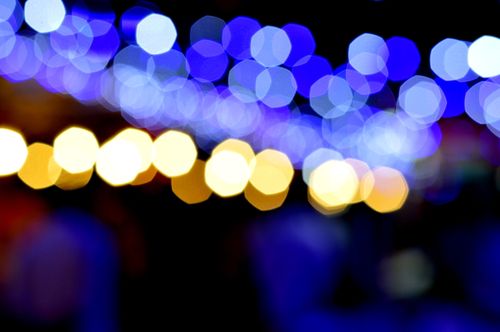 Free Abstract bokeh photography capturing vibrant blue and orange city lights at night. Stock Photo