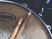 Two Brown Drum Sticks on Brown Snare Stick