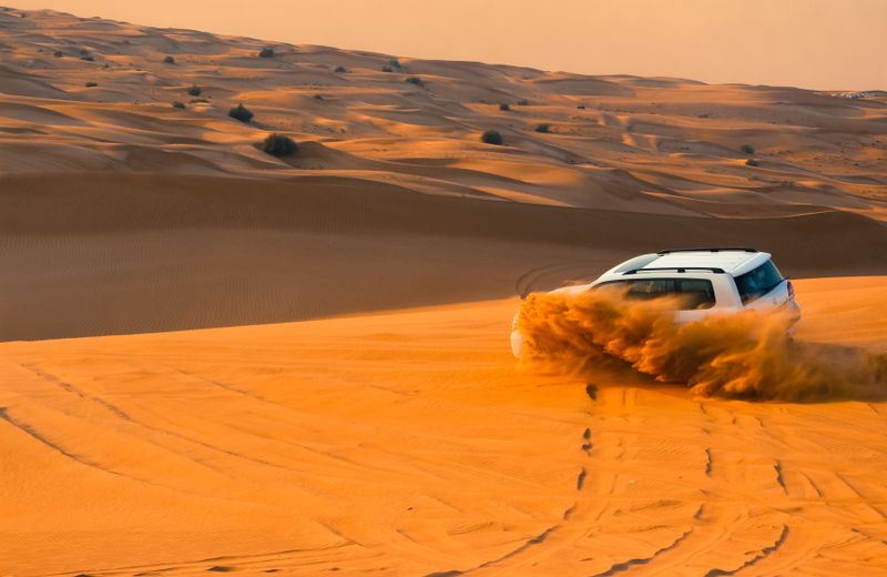Sunset over the red dunes outside Dubai