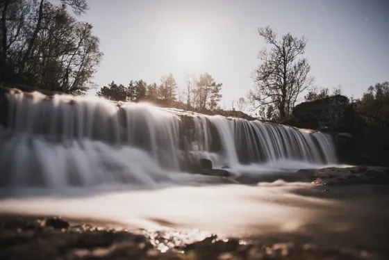 A small waterfall spilling into the Niobrara River canyon