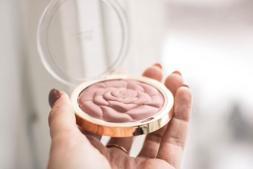 Free Person Holding Compact Powder Stock Photo