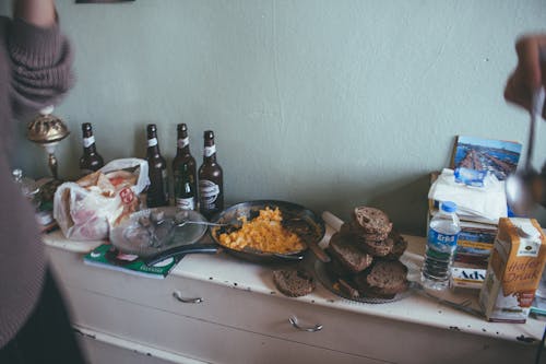 White Labeled Bottle on White Wooden Table