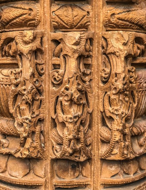 Free Close-up of detailed carvings on an Indian temple wall showcasing religious art and architecture. Stock Photo