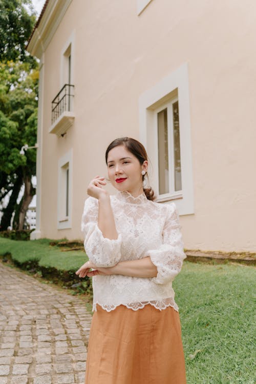 Portrait of Woman in White Shirt and Skirt