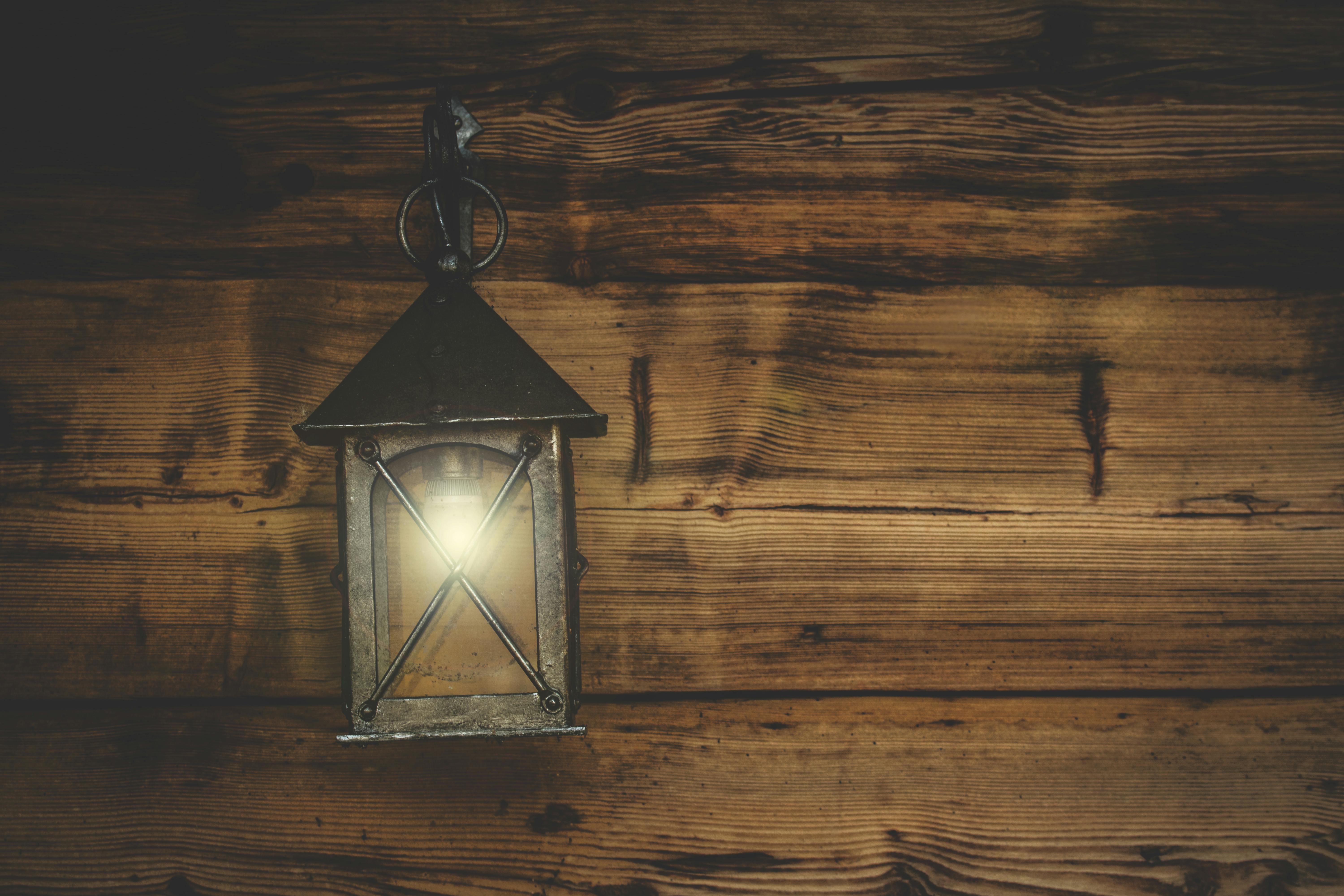 Black Metal Candle Lantern Hanging on Wood Wall \u00b7 Free Stock Photo
