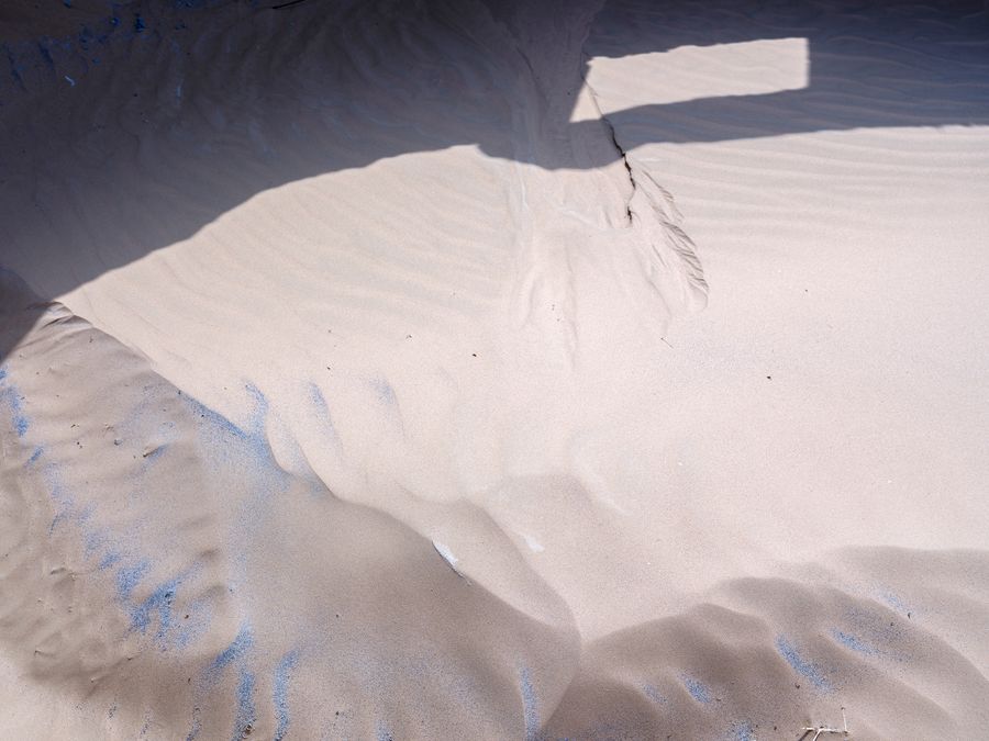 Sunlit patterns across beach sand, photo by zeng jinwen on Pexels