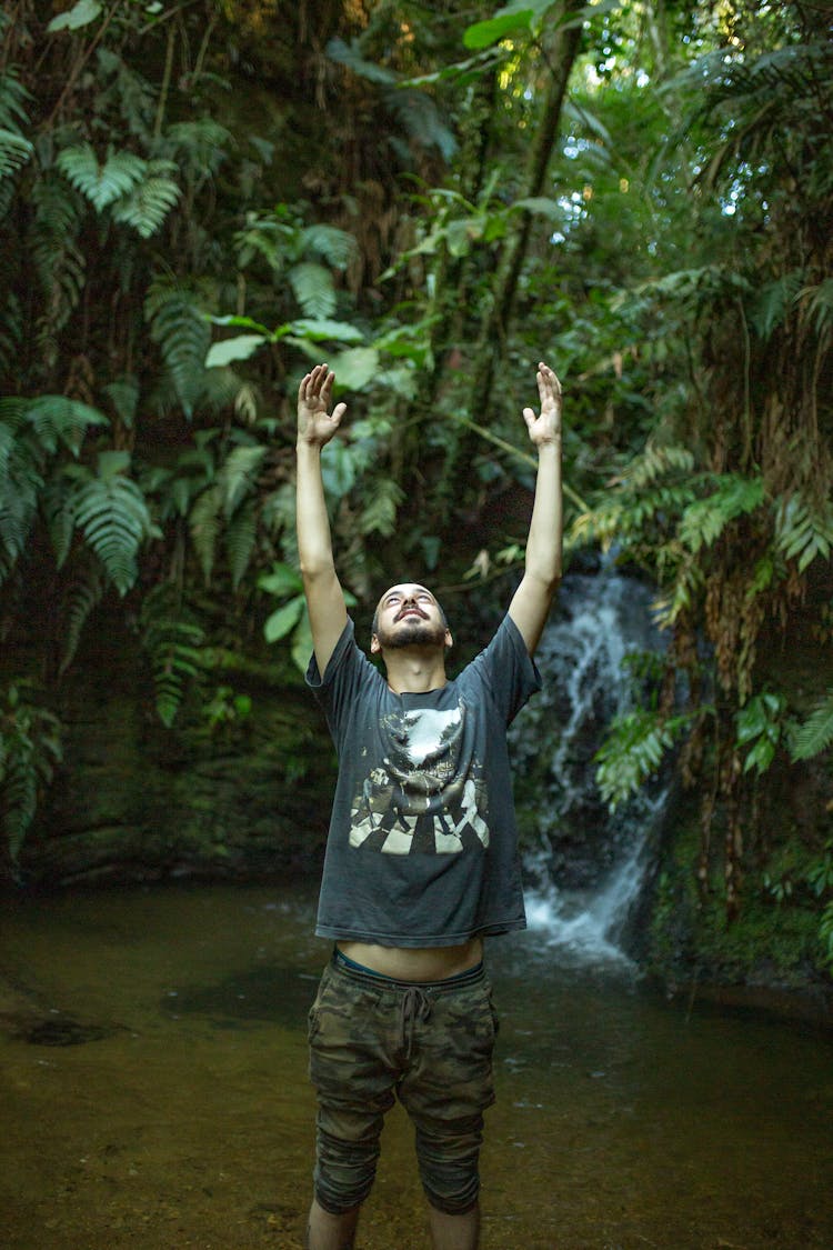 Man Raising His Hands Up