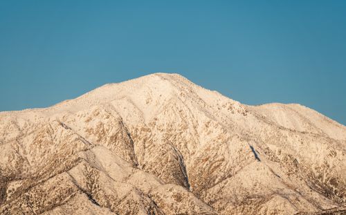 Free Breathtaking view of a snow-covered mountain peak against a clear blue sky in Redlands, California. Stock Photo