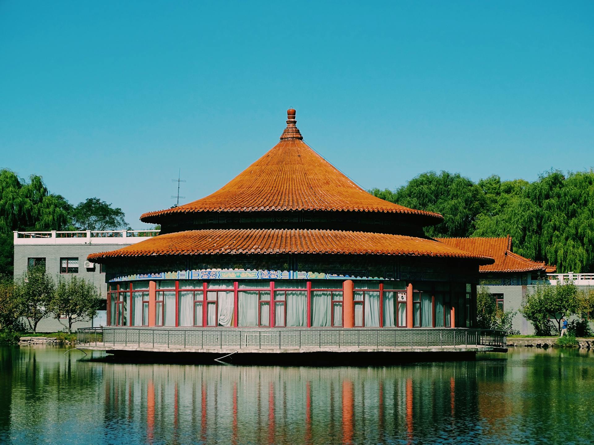 A traditional Chinese pavilion with a reflection in water at Shenyang, Liaoning, China.