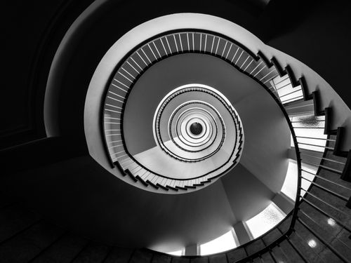 Free Captivating black and white view of a spiral staircase in Hamburg, showcasing modern architectural elegance. Stock Photo