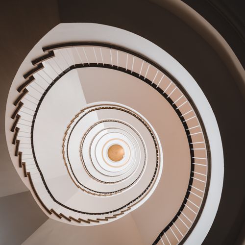 Free Elegant spiral staircase in a Hamburg building interior, captured in a square format. Stock Photo